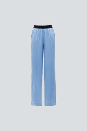 Front view of blue Vibrant Silk Pants with black elastic waistband and flowing silhouette.