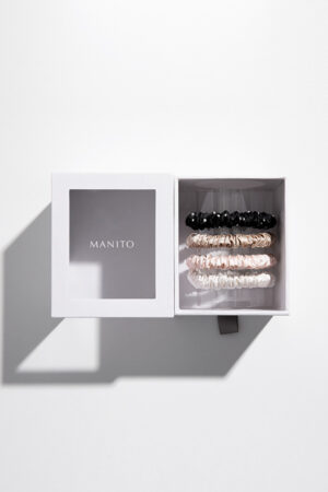 Boxed set of four MANITO Twinkle Mulberry Silk Scrunchies in color A with crystal accents.