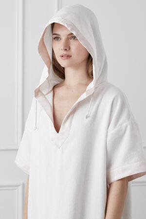 Chic woman in a Cosy Hooded Dress with Silk Trim, showcasing a casual yet luxurious style.