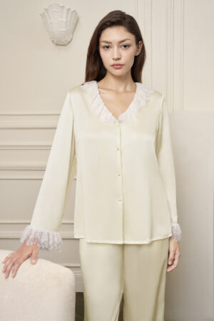 Model in Court Women's Pajama Set, showing delicate lace accents and pearl buttons elevate everyday elegance.