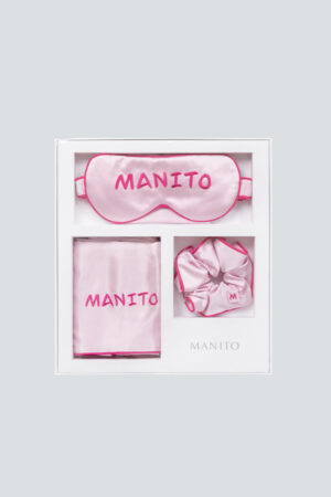 Elegantly packaged MANITO macaron silk eye mask gift box displayed, ideal for a luxurious gift, includes eye mask, scrunchie, and pillowcase.