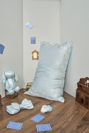 Blue pillowcase and scrunchy from Alice Daisy Sleeping Beauty Gift Box, styled with plush bunny and tiny furniture for a whimsical scene.