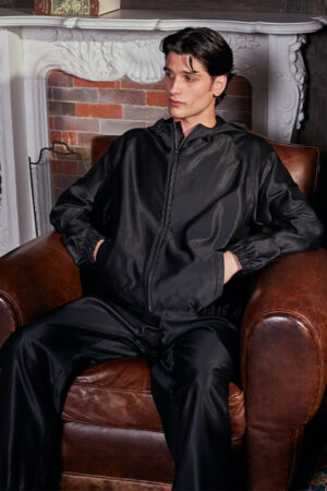 Monogram Cotton Silk Hoodie front view with drawstring high collar and zip-up design.