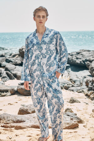 Model wearing MANITO Ocean Blue Men's Pajama Set, featuring long sleeves and a relaxed fit.