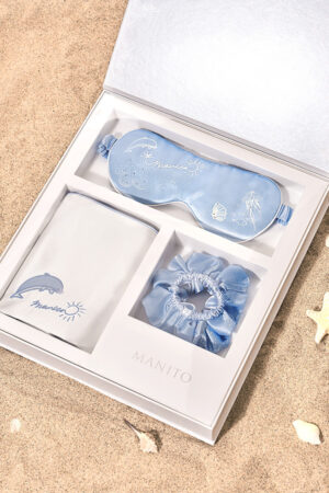 MANITO Ocean Blue Sleeping Beauty Gift Box arranged in a premium white box on the beach.