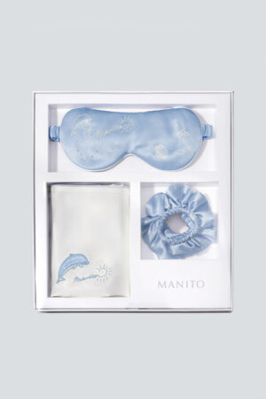MANITO Ocean Blue Sleeping Beauty Gift Box in top view, featuring silk eye mask, pillowcase, and scrunchie.