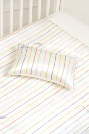 Silk baby pillow on the MANITO Ocean Stripe baby crib bedding set, decorated with embroidered dolphin and shell motifs.