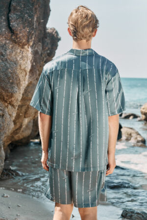 Back view of MANITO Ocean Stripe Men's Short Pajama Set worn outdoors, highlighting the striped pattern.