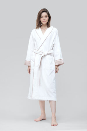 Woman wearing Brimmy Silk Terry Women’s Robe with elegant pink trim detailing.